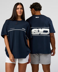 Duo wearing Inline Heavyweight FLXCotton Oversized Tee - Midnight Navy-White | Model:Rhiley | Size:XS | Model:Xav | Size:L | Thumbnail Index: 0