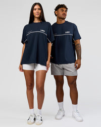 Duo wearing Inline Heavyweight FLXCotton Oversized Tee - Midnight Navy-White | Model:Rhiley | Size:XS | Model:Xav | Size:L | Thumbnail Index: 6