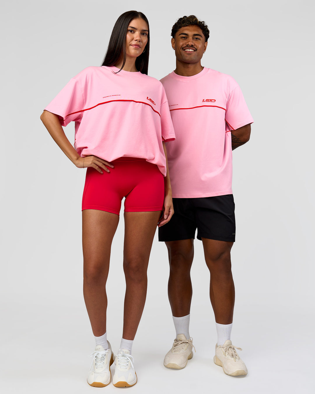 Duo wearing Inline Heavyweight FLXCotton Oversized Tee - Pink Rose-Flame | Model:Rhiley | Size:XS | Model:Xav | Size:L - view 4