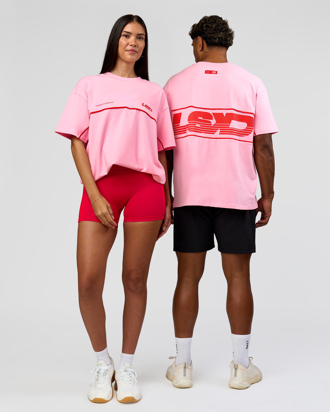 Duo wearing Inline Heavyweight FLXCotton Oversized Tee - Pink Rose-Flame | Model:Rhiley | Size:XS | Model:Xav | Size:L - view 13