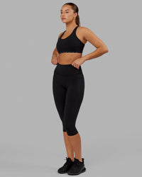 Woman wearing O.G. Fusion Ultra High-Rise 3/4 Legging Pockets - Black | Model:Milly | Size:S | Thumbnail Index: 5
