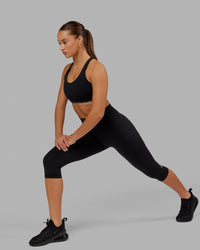 Woman wearing O.G. Fusion Ultra High-Rise 3/4 Legging Pockets - Black | Model:Milly | Size:S | Thumbnail Index: 3
