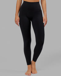 Woman wearing O.G. Fusion Ultra High-Rise Full Length Legging Pockets - Black | Model:Milly | Size:S | Thumbnail Index: 7