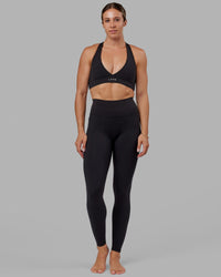 Woman wearing O.G. Fusion Ultra High-Rise Tall Legging Pockets - Black | Model:Bree | Size:S | Thumbnail Index: 0