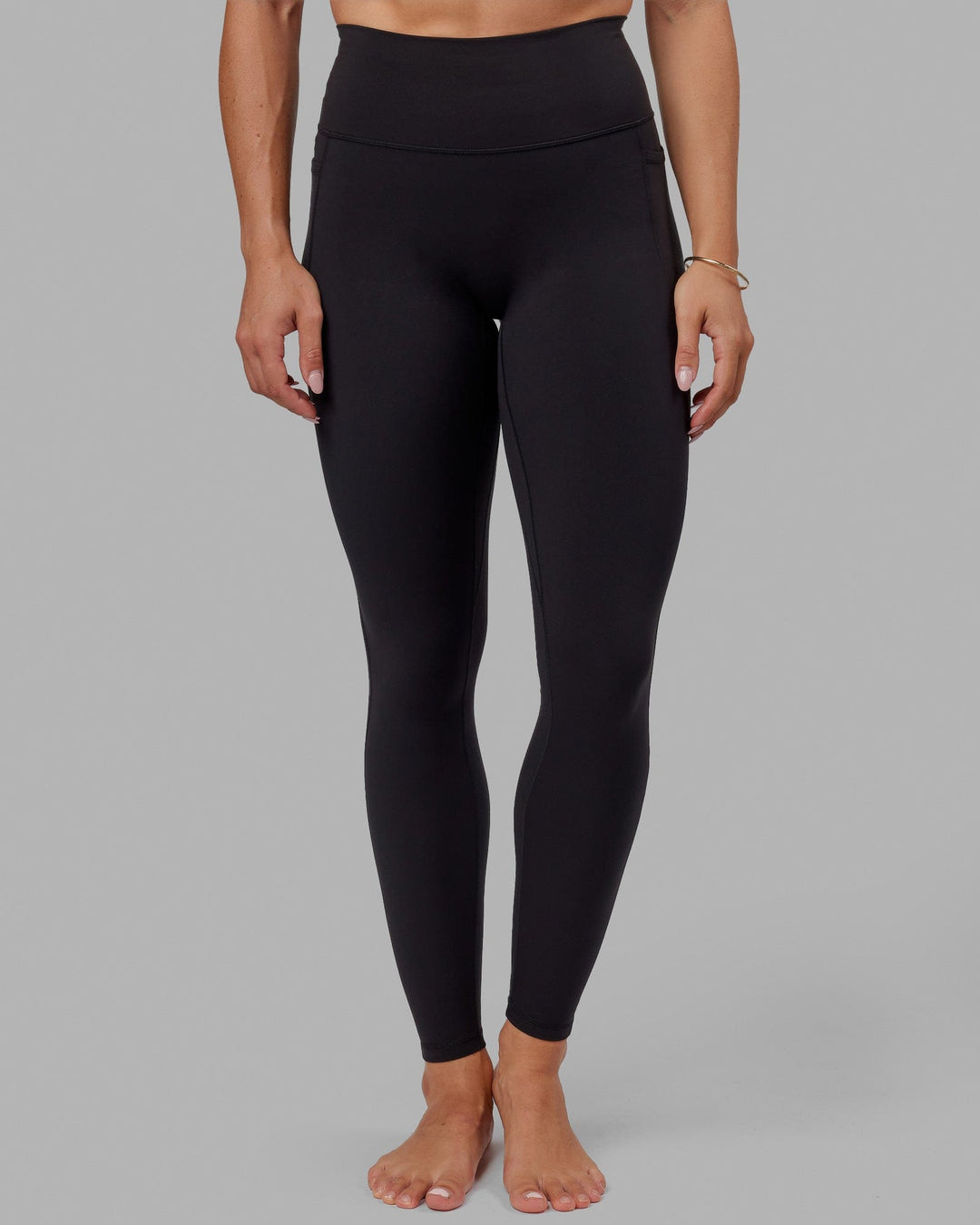 Woman wearing O.G. Fusion Ultra High-Rise Tall Legging Pockets - Black | Model:Bree | Size:S - view 9