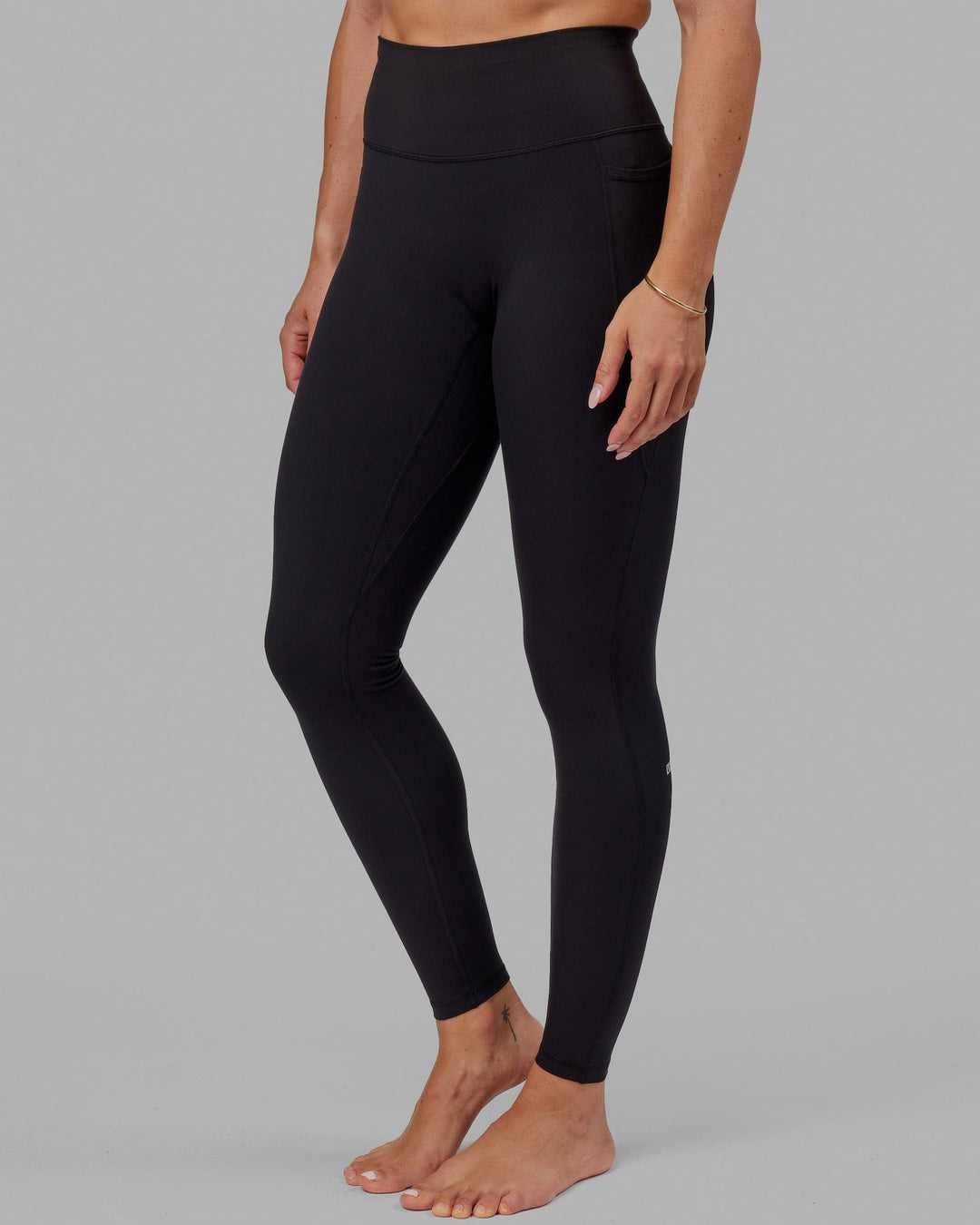 Woman wearing O.G. Fusion Ultra High-Rise Tall Legging Pockets - Black | Model:Bree | Size:S - view 5