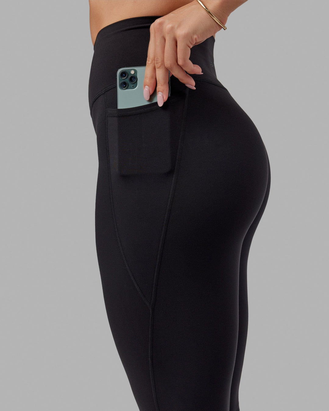 Woman wearing O.G. Fusion Ultra High-Rise Tall Legging Pockets - Black | Model:Bree | Size:S - view 2