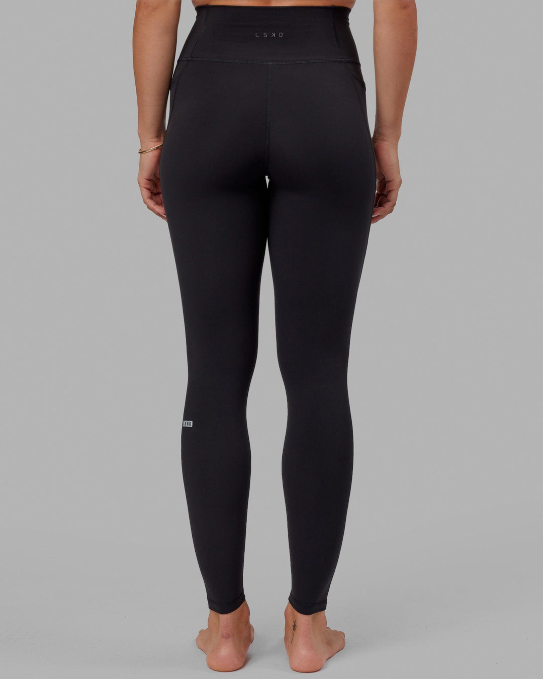 Woman wearing O.G. Fusion Ultra High-Rise Tall Legging Pockets - Black | Model:Bree | Size:S - view 8