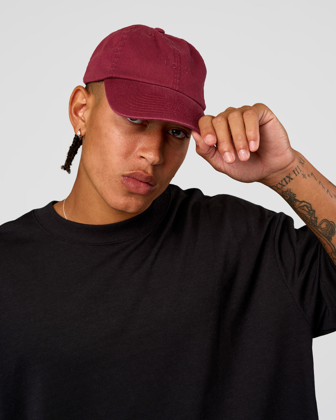 Man wearing All Day Cap - Cherry Lacquer | Model:Day | Size:ALL - view 1