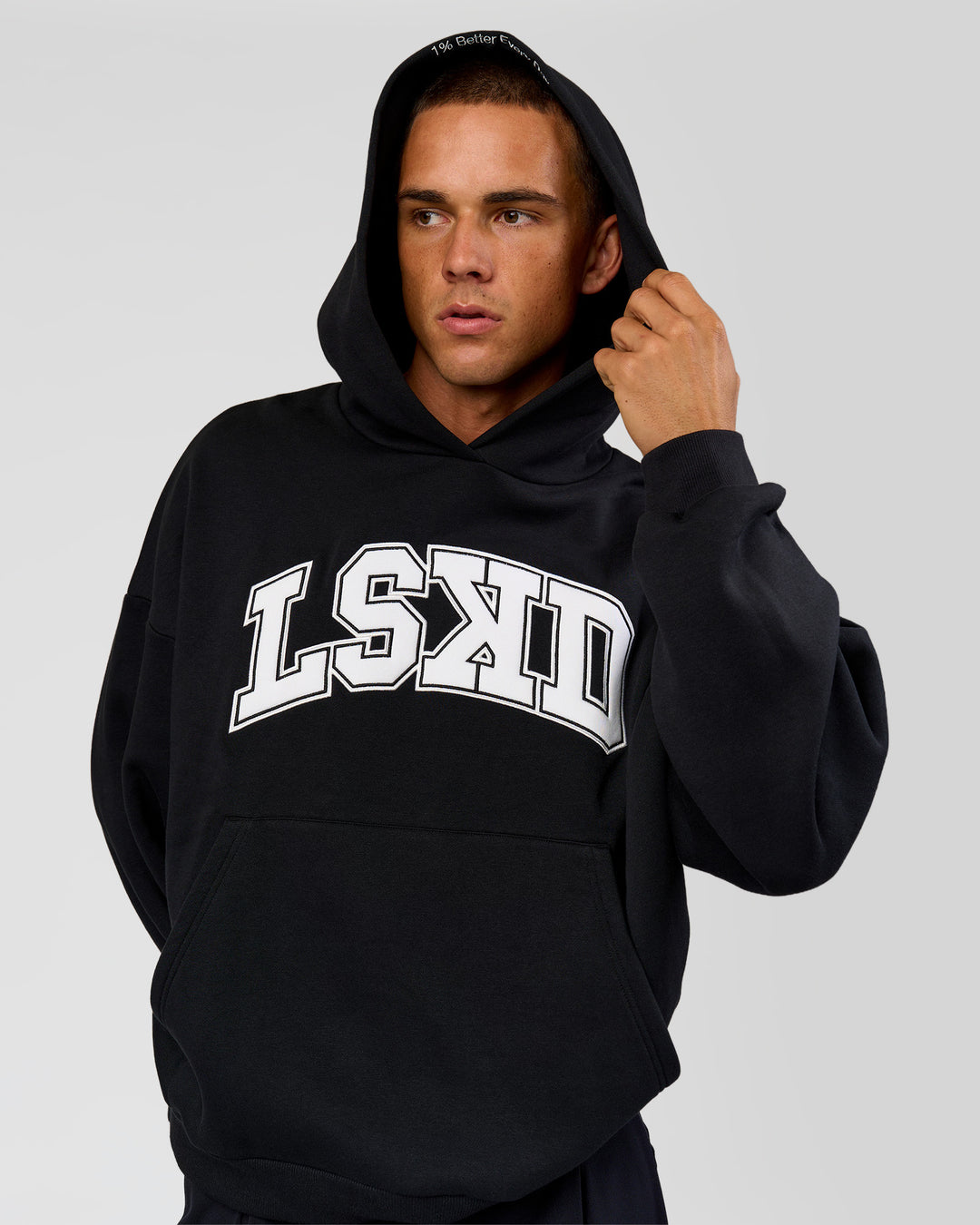 Man wearing Varsity Boxy Hoodie - Caviar-White | Model:Albert | Size:L - view 6