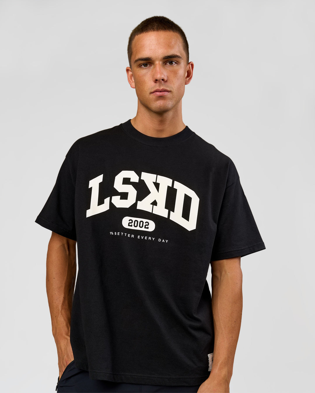 Man wearing Varsity EST Heavyweight Oversized Tee  - Black-Off White | Model:Albert | Size:L - view 1