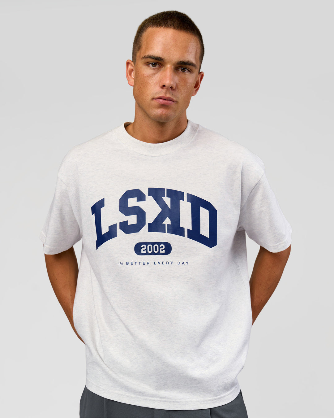 Man wearing Varsity EST Heavyweight Oversized Tee  - Silver Marl-Future Navy | Model:Albert | Size:L - view 11