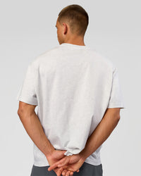 Man wearing Varsity EST Heavyweight Oversized Tee  - Silver Marl-Future Navy | Model:Albert | Size:L | Thumbnail Index: 12