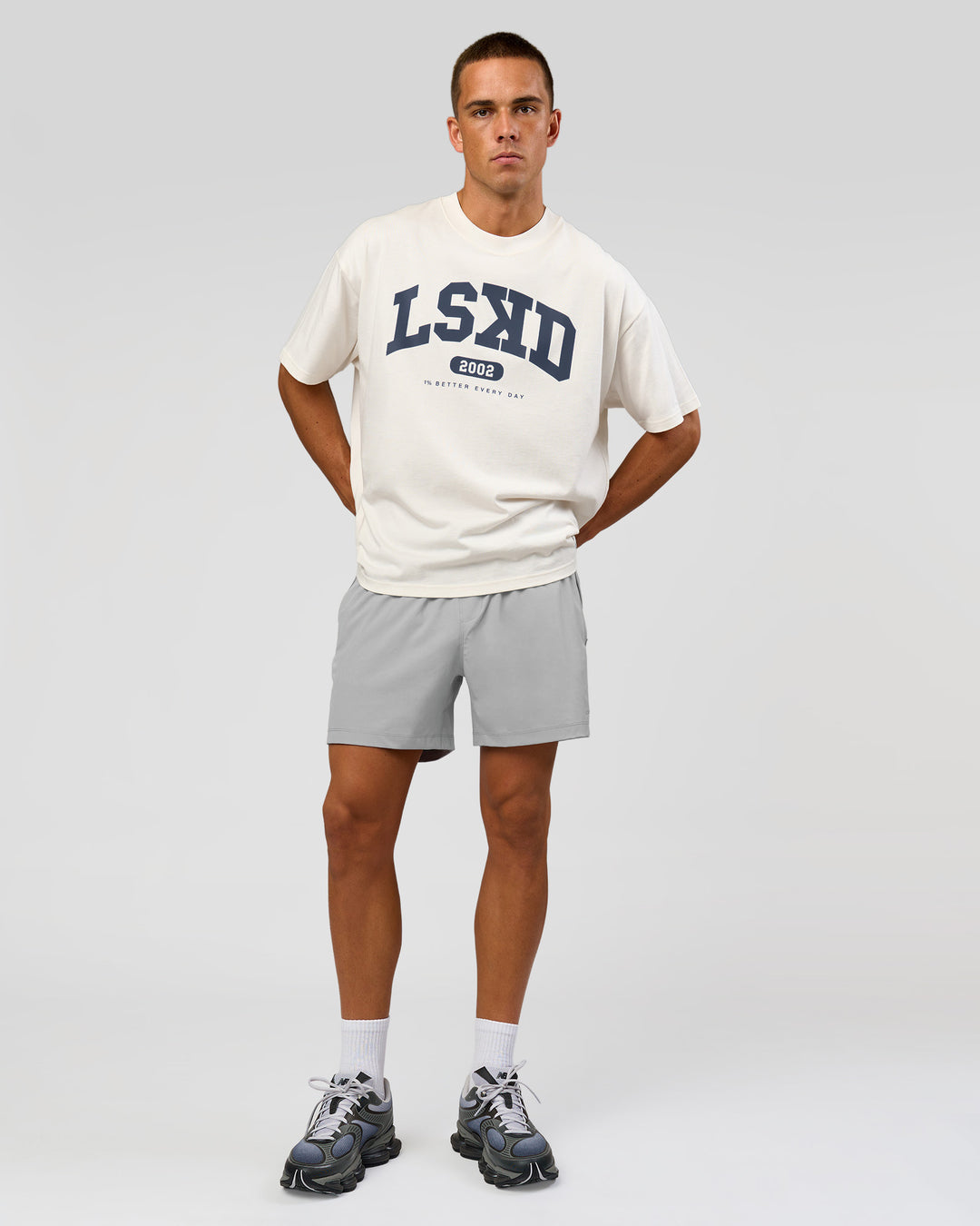 Man wearing Varsity EST Heavyweight Oversized Tee  - Off White-Future Navy | Model:Albert | Size:L - view 2