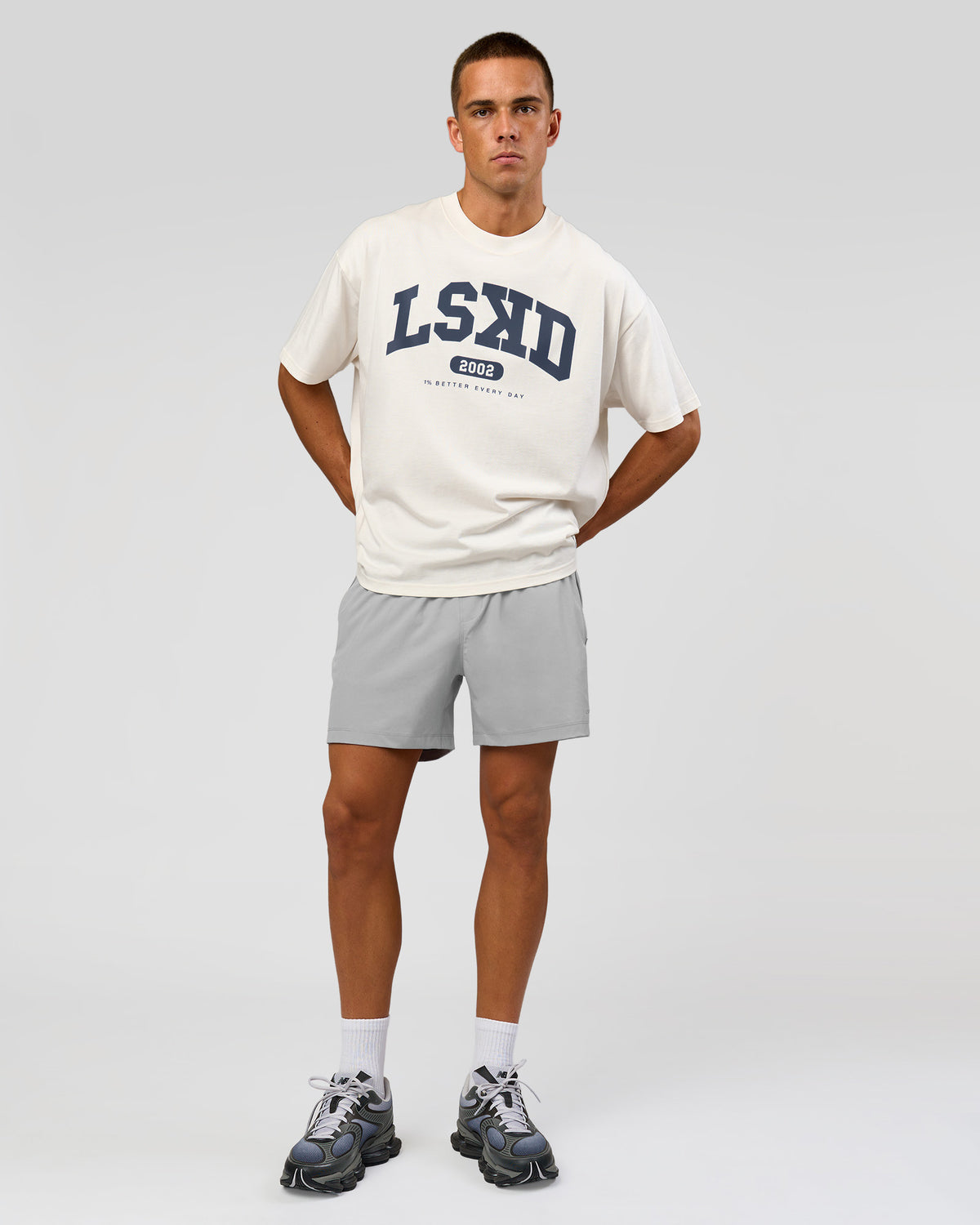 Man wearing Varsity EST Heavyweight Oversized Tee  - Off White-Future Navy | Model:Albert | Size:L