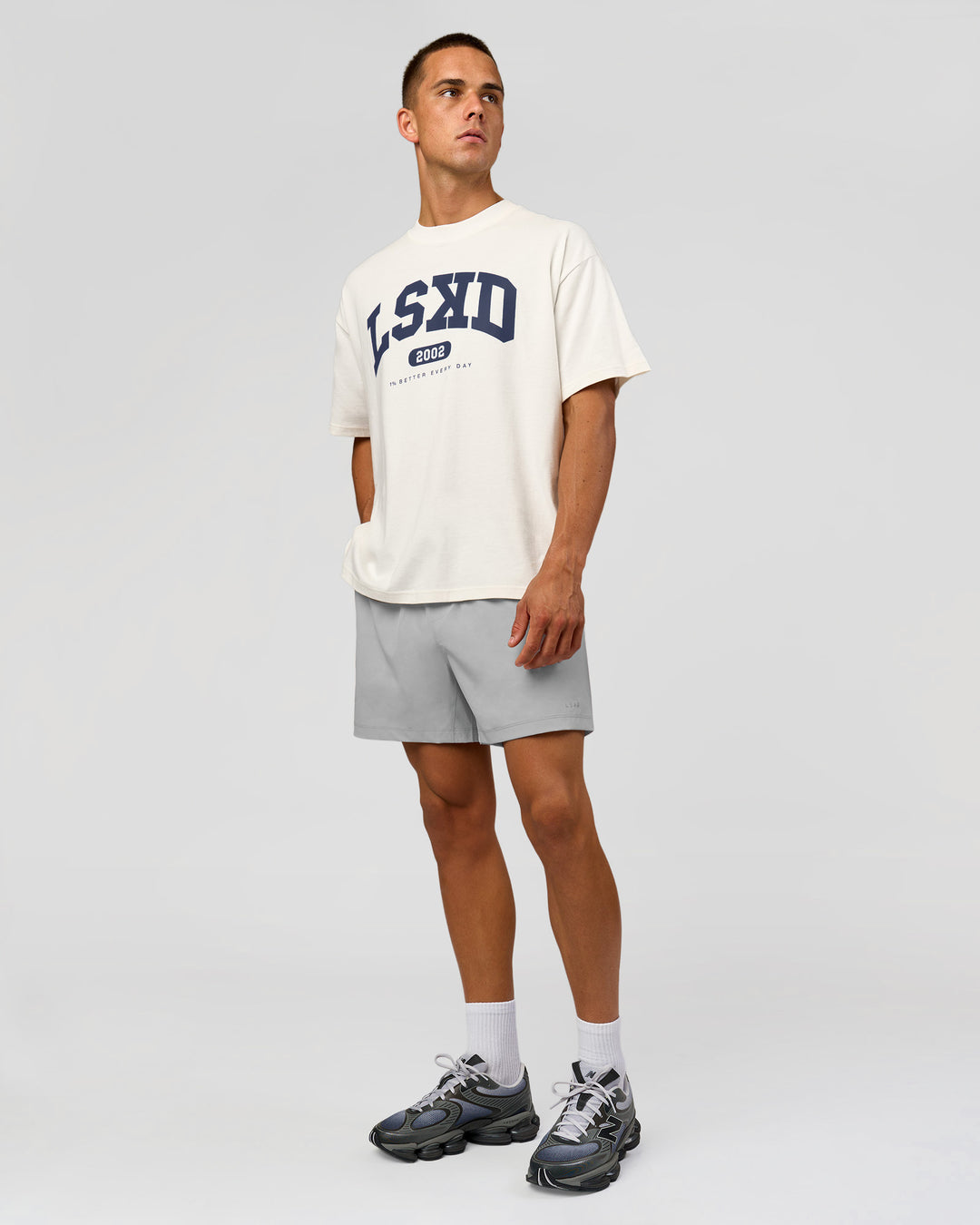 Man wearing Varsity EST Heavyweight Oversized Tee  - Off White-Future Navy | Model:Albert | Size:L - view 8