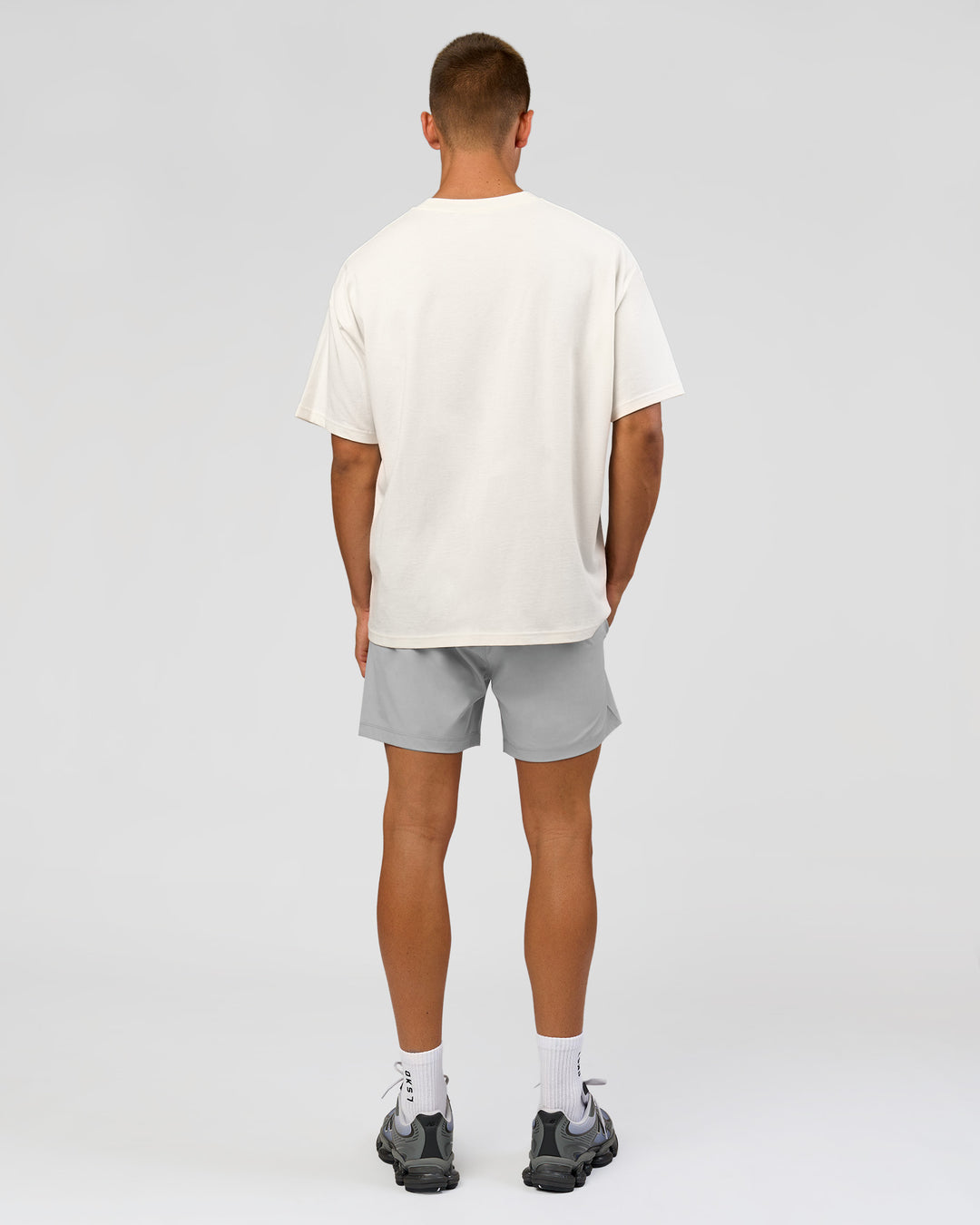 Man wearing Varsity EST Heavyweight Oversized Tee  - Off White-Future Navy | Model:Albert | Size:L - view 13