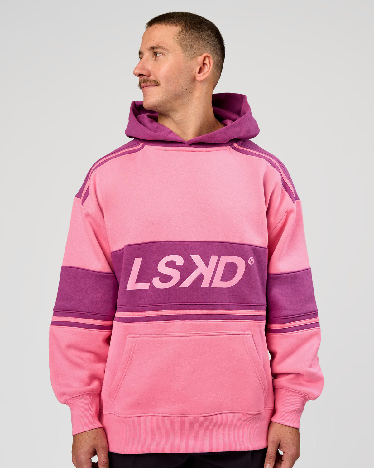 Man wearing A-Team Oversized Hoodie - Candy Pink-Boysenberry | Model:Jaiden | Size:L - view 2