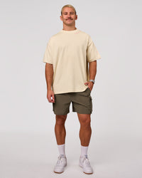 Man wearing Bree Heavyweight Oversized Tee - Vanilla Bean | Model:Jaiden | Size:L | Thumbnail Index: 12