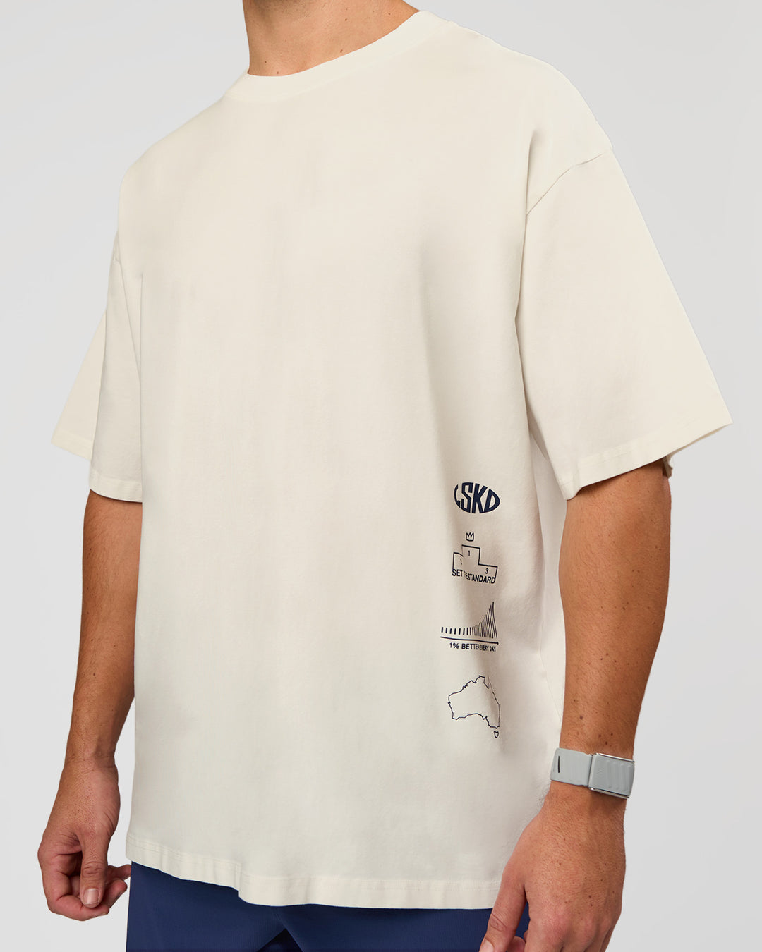 Man wearing Greatest of All Time Heavyweight FLXCotton Oversized Tee - Off White Washed-Scarlet | Model:Jaiden | Size:L - view 26