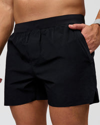 Man wearing Hybrid Lined 5" Short - Black-Reflective | Model:Jaiden | Size:L | Thumbnail Index: 0