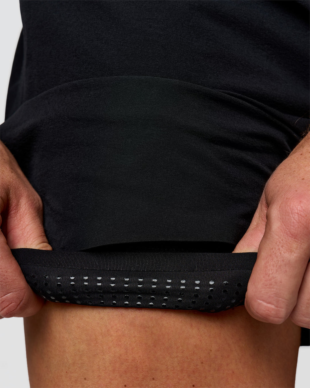 Man wearing Hybrid Lined 5" Short - Black-Reflective | Model:Jaiden | Size:L - view 8