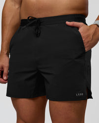 Man wearing Pace 5" Lined Ripstop Short - Black | Model:Jaiden | Size:L | Thumbnail Index: 0