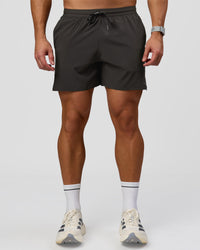 Man wearing Pace 5" Lined Running Short - Black-Onyx | Model:Jaiden | Size:L | Thumbnail Index: 11