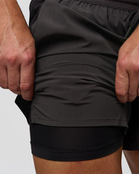 Man wearing Pace 5" Lined Running Short - Black-Onyx | Model:Jaiden | Size:L | Thumbnail Index: 13
