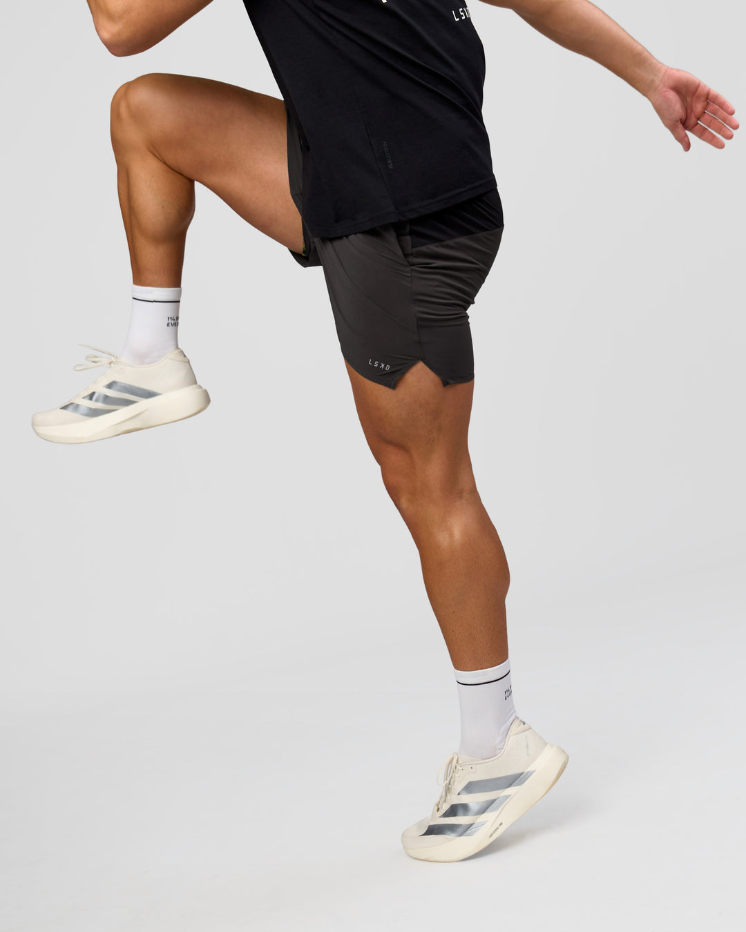 Man wearing Pace 5" Lined Running Short - Black-Onyx | Model:Jaiden | Size:L - view 6