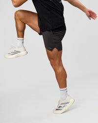 Man wearing Pace 5" Lined Running Short - Black-Onyx | Model:Jaiden | Size:L | Thumbnail Index: 5