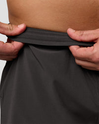 Man wearing Pace 5" Lined Running Short - Black-Onyx | Model:Jaiden | Size:L | Thumbnail Index: 8