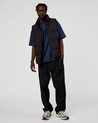 Man wearing Base Puffer Vest - Black | Model:Okello | Size:L | Thumbnail Index: 0
