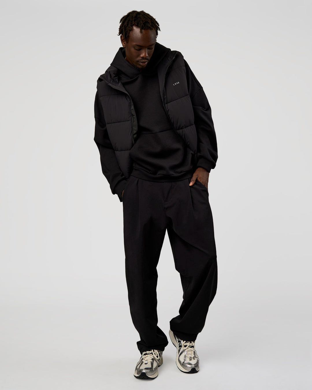 Man wearing Base Puffer Vest - Black | Model:Okello | Size:L - view 4