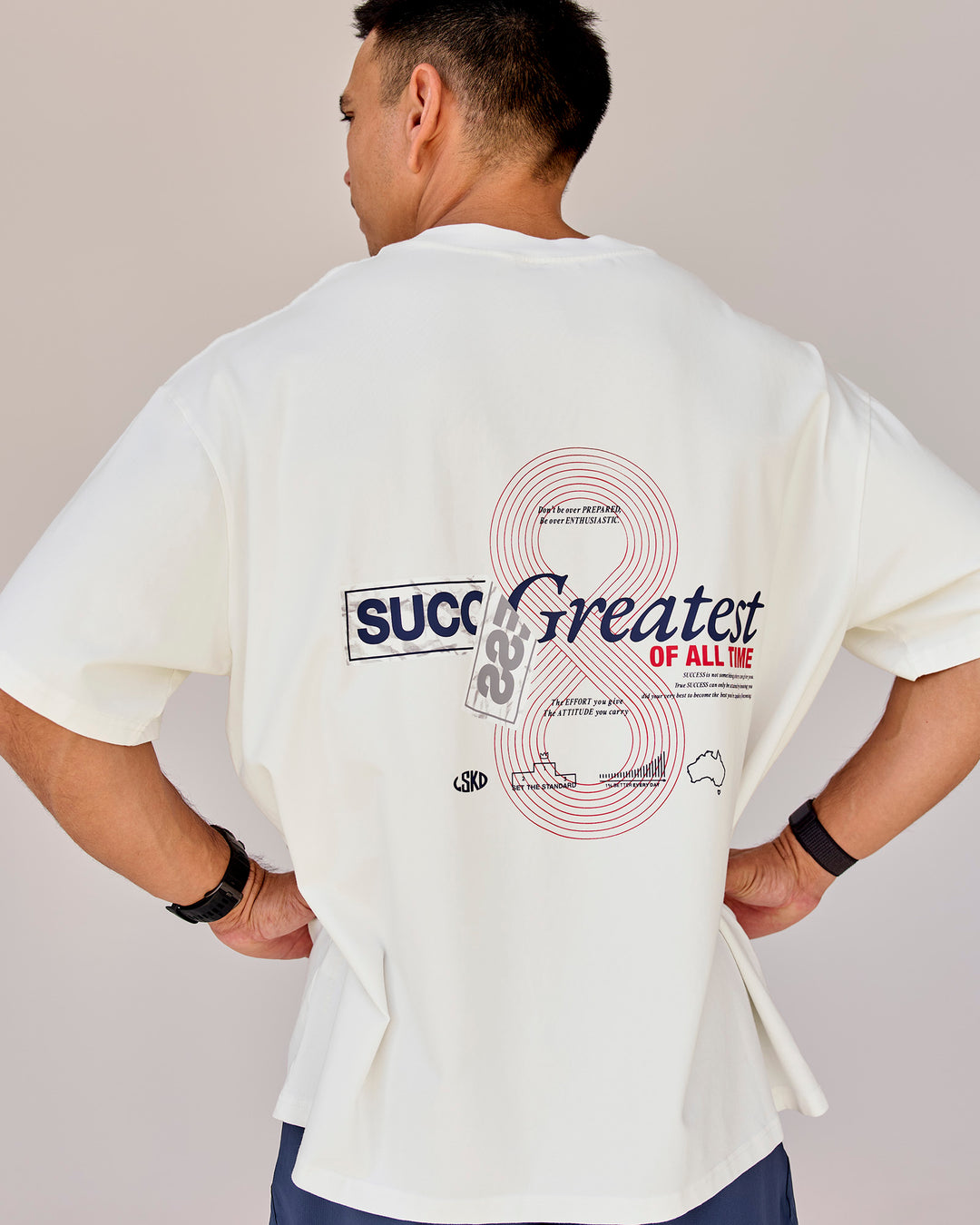 Man wearing Greatest of All Time Heavyweight FLXCotton Oversized Tee - Off White Washed-Scarlet | Model:Shane | Size:L - view 17