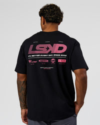 Man wearing Archive FLXCotton Oversized Tee - Black-Candy Pink | Model:Xav | Size:L | Thumbnail Index: 1