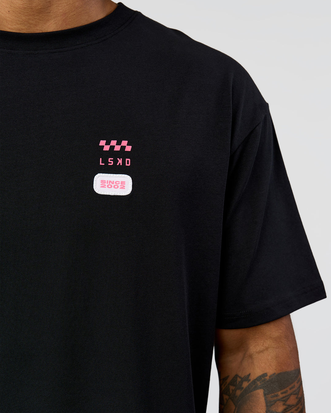 Man wearing Archive FLXCotton Oversized Tee - Black-Candy Pink | Model:Xav | Size:L - view 11