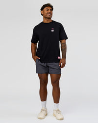 Man wearing Archive FLXCotton Oversized Tee - Black-Candy Pink | Model:Xav | Size:L | Thumbnail Index: 12