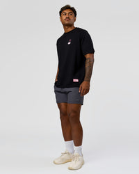 Man wearing Archive FLXCotton Oversized Tee - Black-Candy Pink | Model:Xav | Size:L | Thumbnail Index: 14