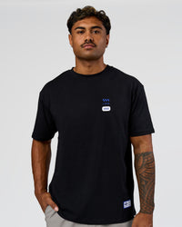 Man wearing Archive FLXCotton Oversized Tee - Black-Electric Indigo | Model:Xav | Size:L | Thumbnail Index: 7
