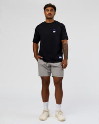 Man wearing Archive FLXCotton Oversized Tee - Black-Electric Indigo | Model:Xav | Size:L | Thumbnail Index: 17