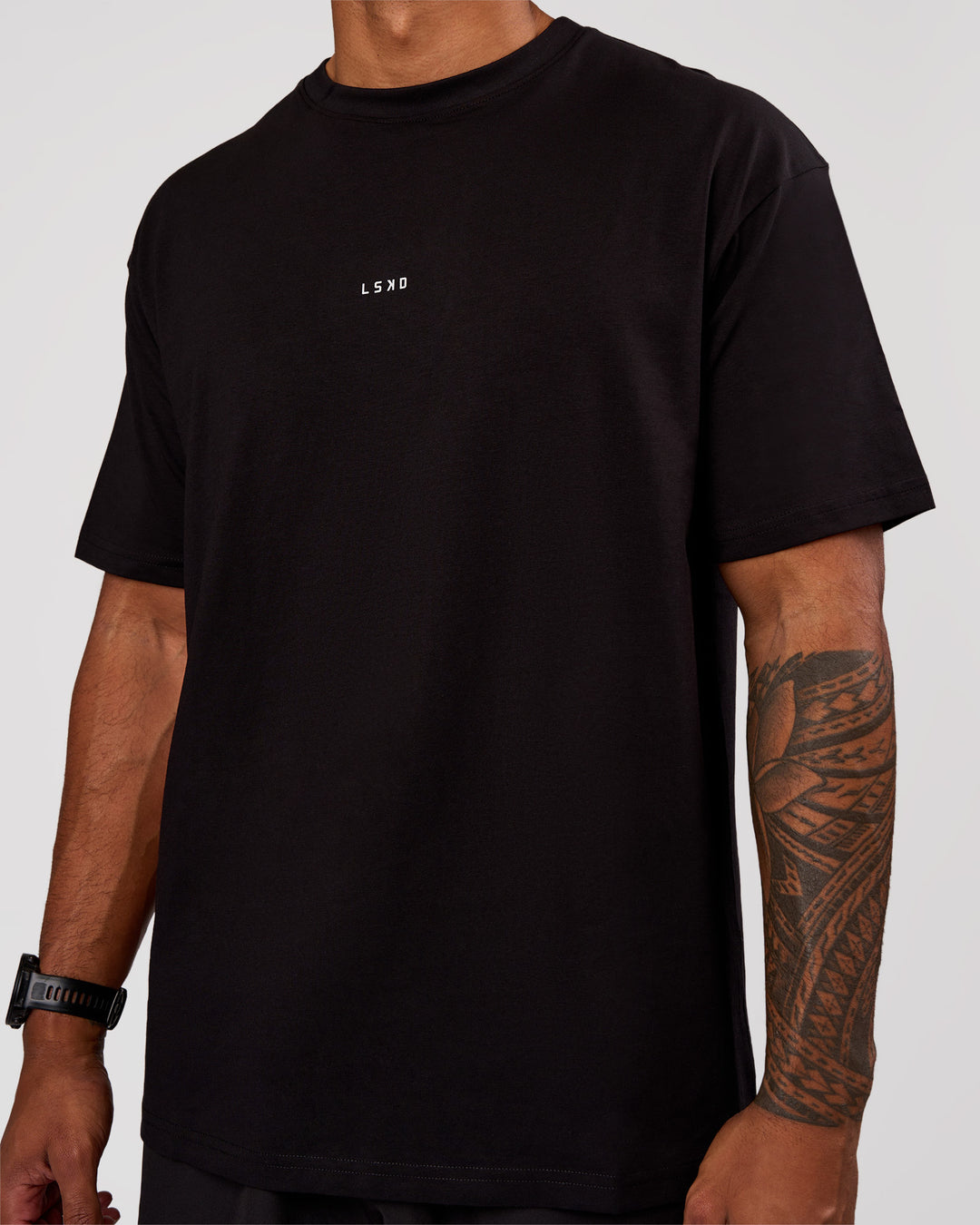 Man wearing Base FLXCotton Tee Oversized - Black | Model:Xav | Size:L - view 2