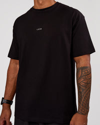Man wearing Base FLXCotton Tee Oversized - Black | Model:Xav | Size:L | Thumbnail Index: 1