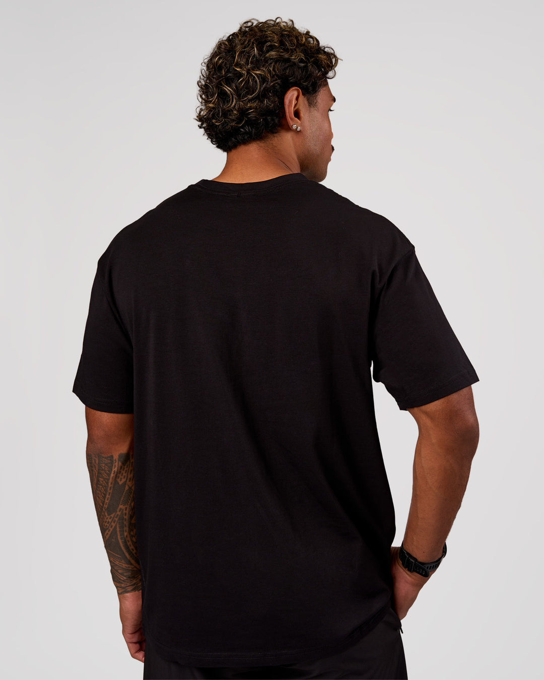Man wearing Base FLXCotton Tee Oversized - Black | Model:Xav | Size:L - view 3