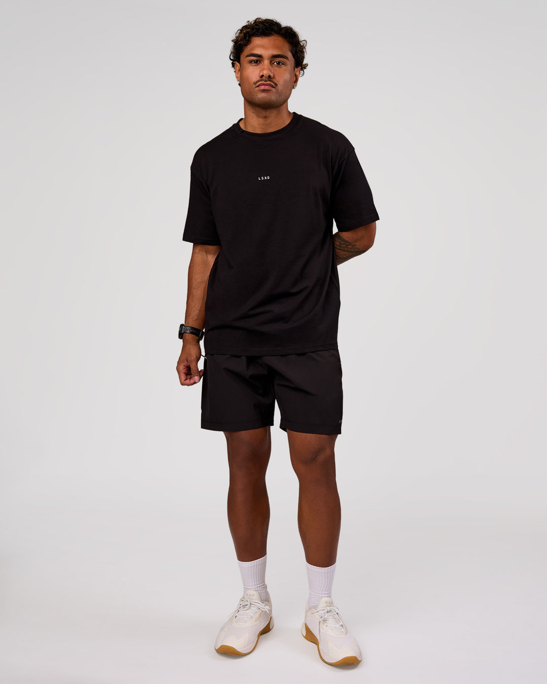 Man wearing Base FLXCotton Tee Oversized - Black | Model:Xav | Size:L - view 4