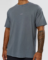 Man wearing Built On Values FLXCotton Oversized Tee - Dark Storm Washed-Pink Rose | Model:Xav | Size:L | Thumbnail Index: 10