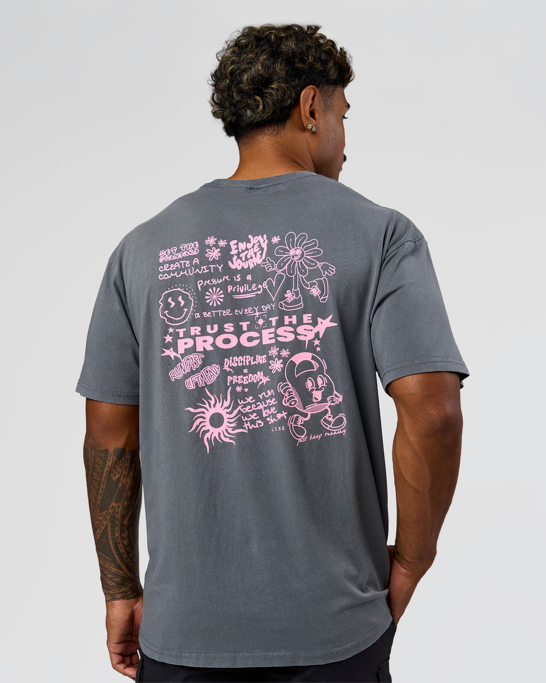 Man wearing Built On Values FLXCotton Oversized Tee - Dark Storm Washed-Pink Rose | Model:Xav | Size:L - view 3