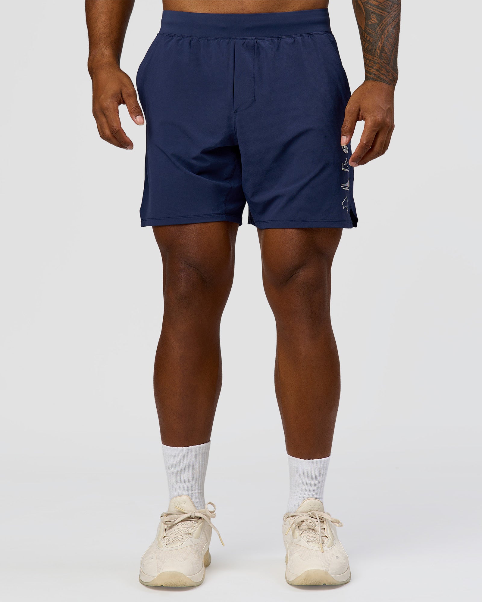 Man wearing Greatest of All Time Functional Training 7" Short - Future Navy-White | Model:Xav | Size:L