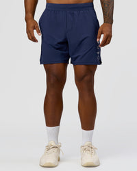 Man wearing Greatest of All Time Functional Training 7" Short - Future Navy-White | Model:Xav | Size:L | Thumbnail Index: 1