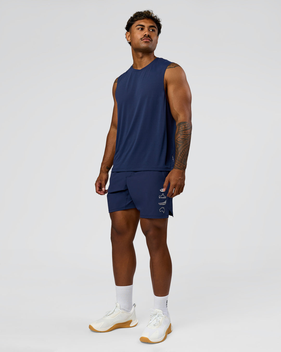 Man wearing Greatest of All Time Functional Training 7" Short - Future Navy-White | Model:Xav | Size:L - view 10